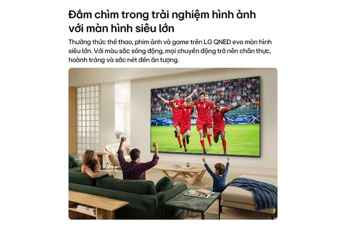 LG QNED evo AI QNED80 Mini LED Ultra Big TV is wall-mounted in a bright living room, showing a soccer celebration with vivid colors and refined picture quality across a wide screen, as a family seated on sofas cheers together.